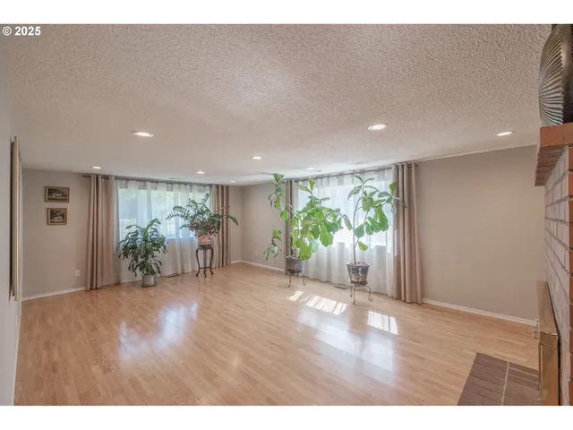 a view of a big room with wooden floor