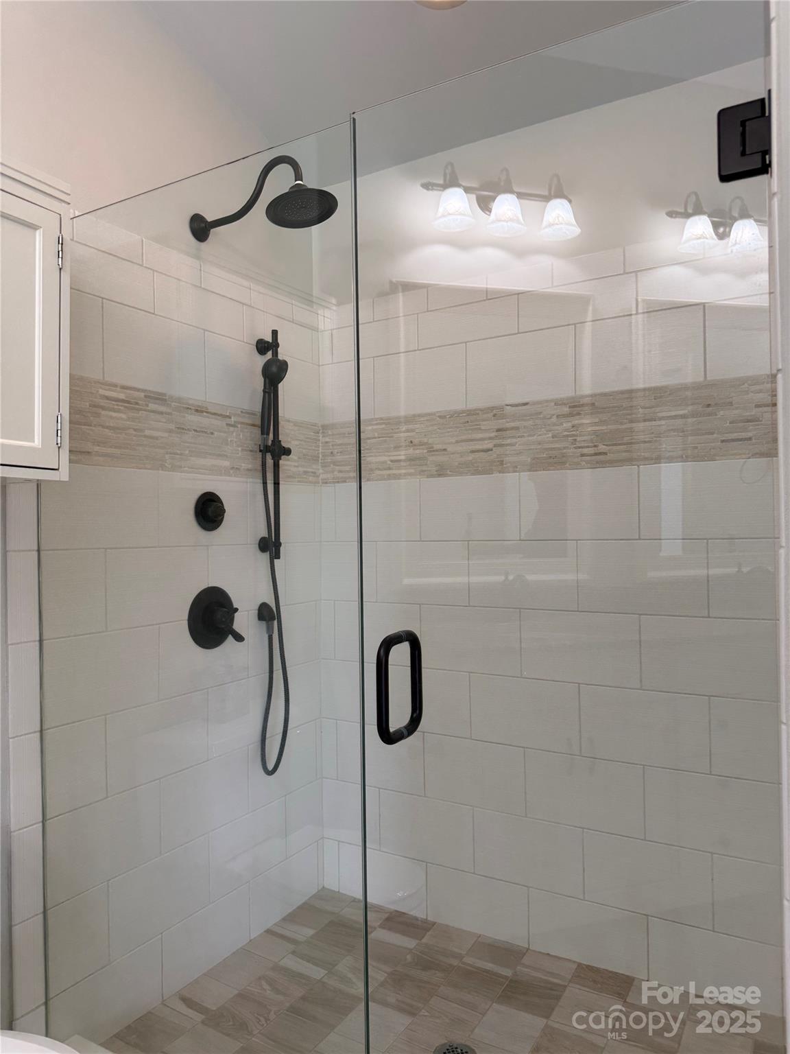 1133 Torrence Circle Davidson, NC 28036 - Photo 12 of 43 a bathroom with a shower