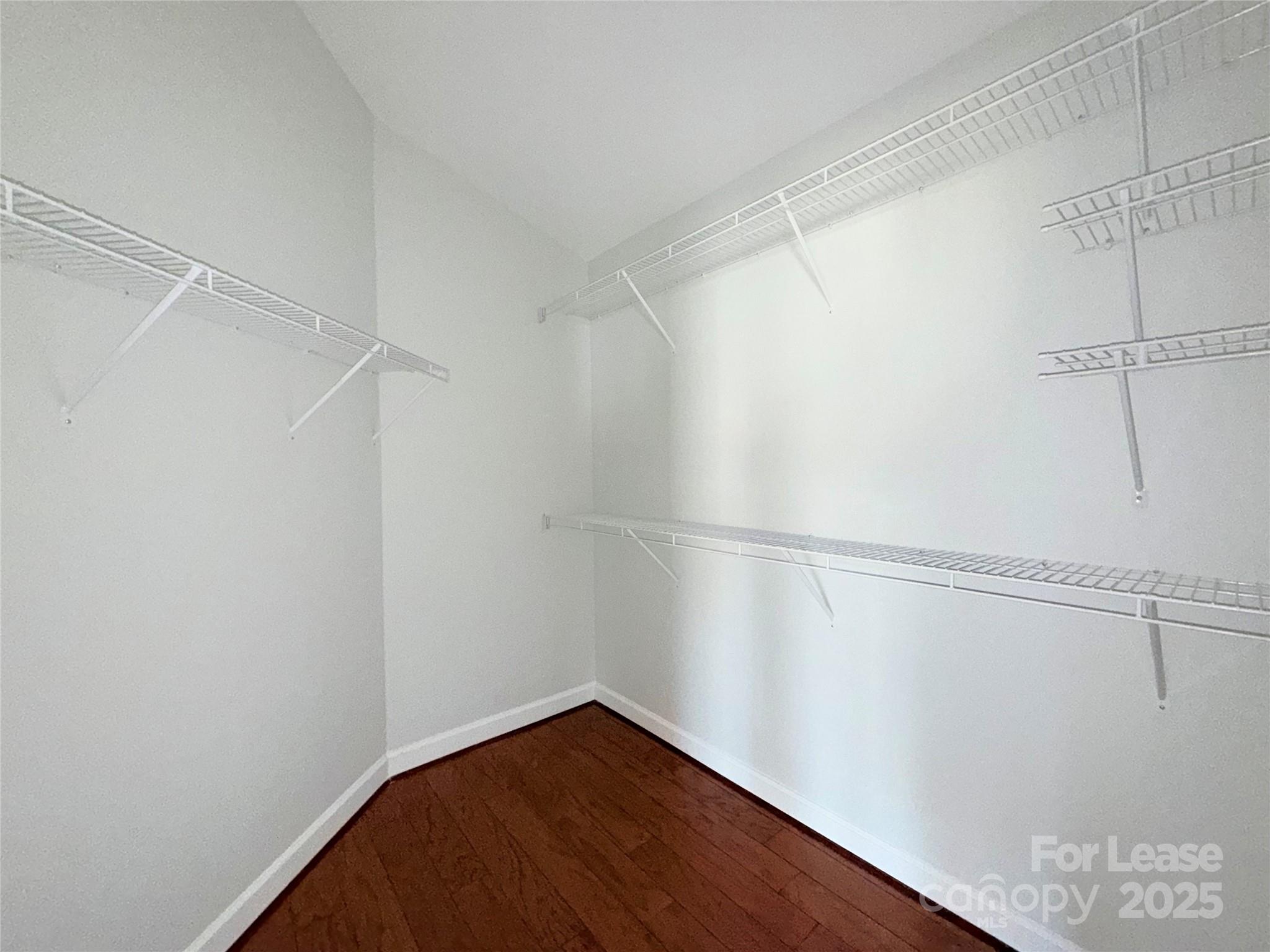 1133 Torrence Circle Davidson, NC 28036 - Photo 15 of 43 a view of a room with racks on the wall