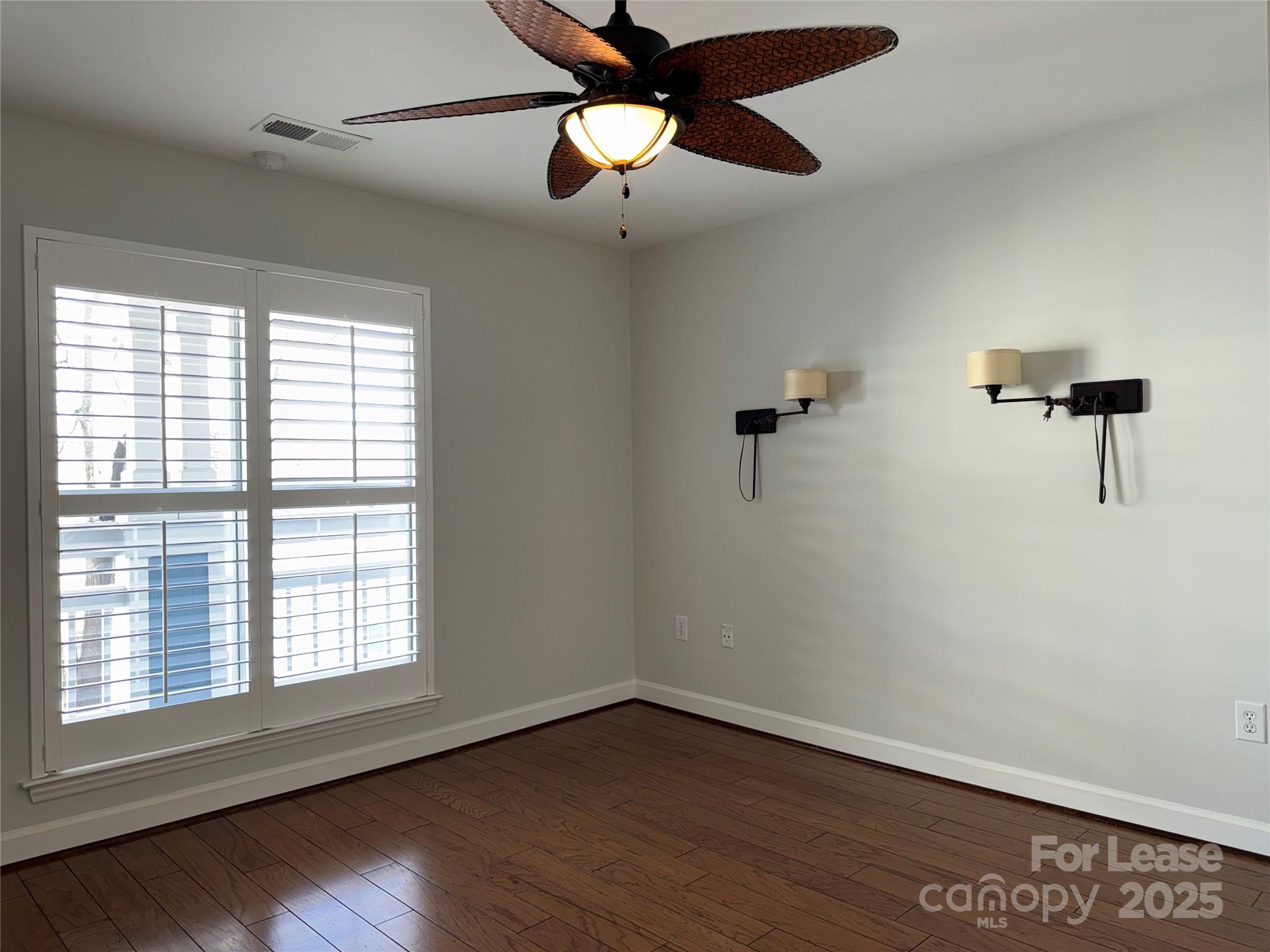 1133 Torrence Circle Davidson, NC 28036 - Photo 18 of 43 a view of a room with a ceiling fan and a window