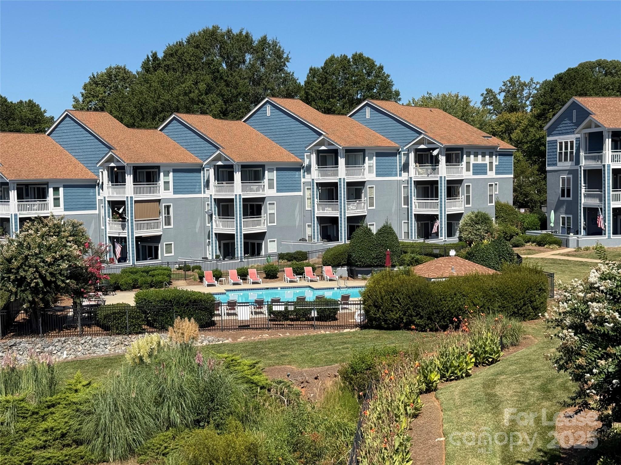 1133 Torrence Circle Davidson, NC 28036 - Photo 36 of 43 a front view of a residential houses with yard and green space
