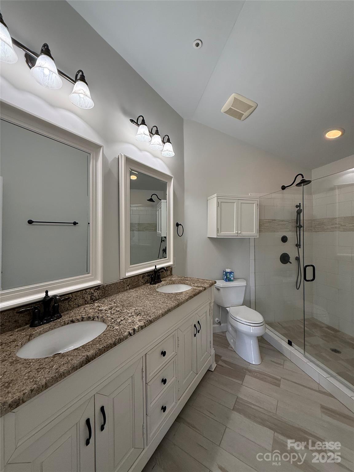 1133 Torrence Circle Davidson, NC 28036 - Photo 10 of 43 a bathroom with a granite countertop sink mirror and toilet