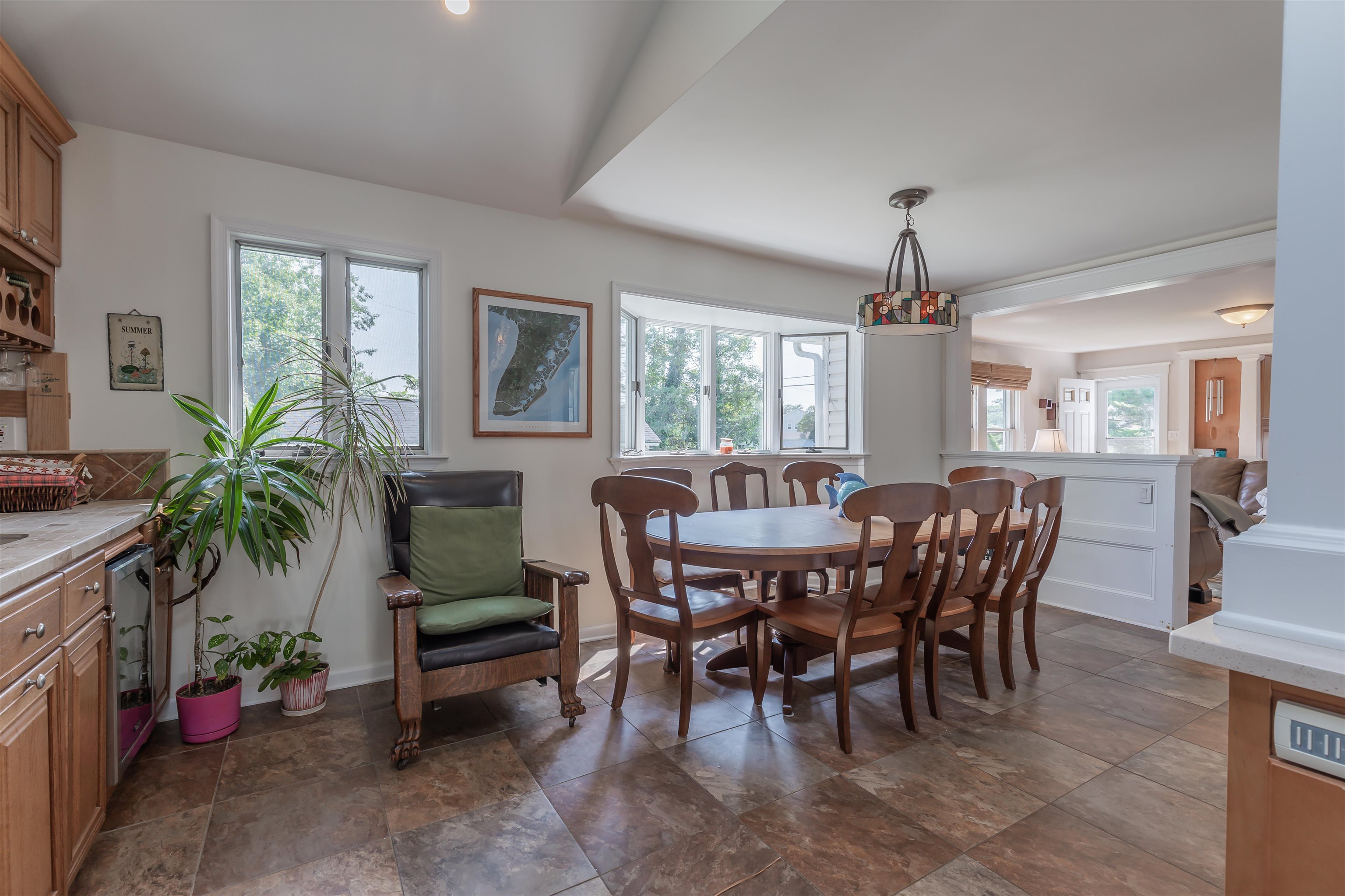1013 Seashore Road Cape May, NJ 08204 - Photo 15 of 44 a view of a dining room with furniture window and wooden floor