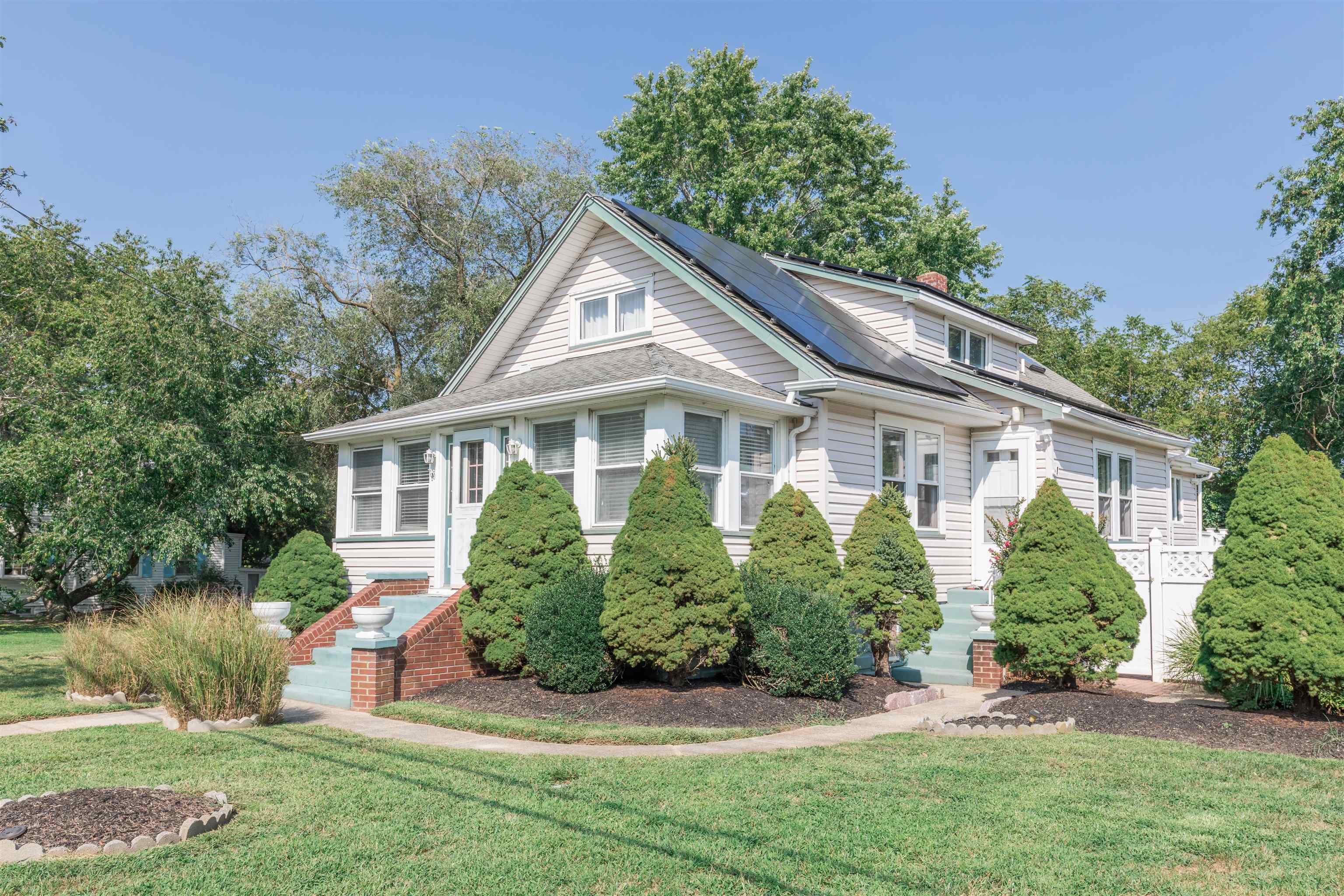 1013 Seashore Road Cape May, NJ 08204 - Photo 2 of 44 front view of a house with a yard