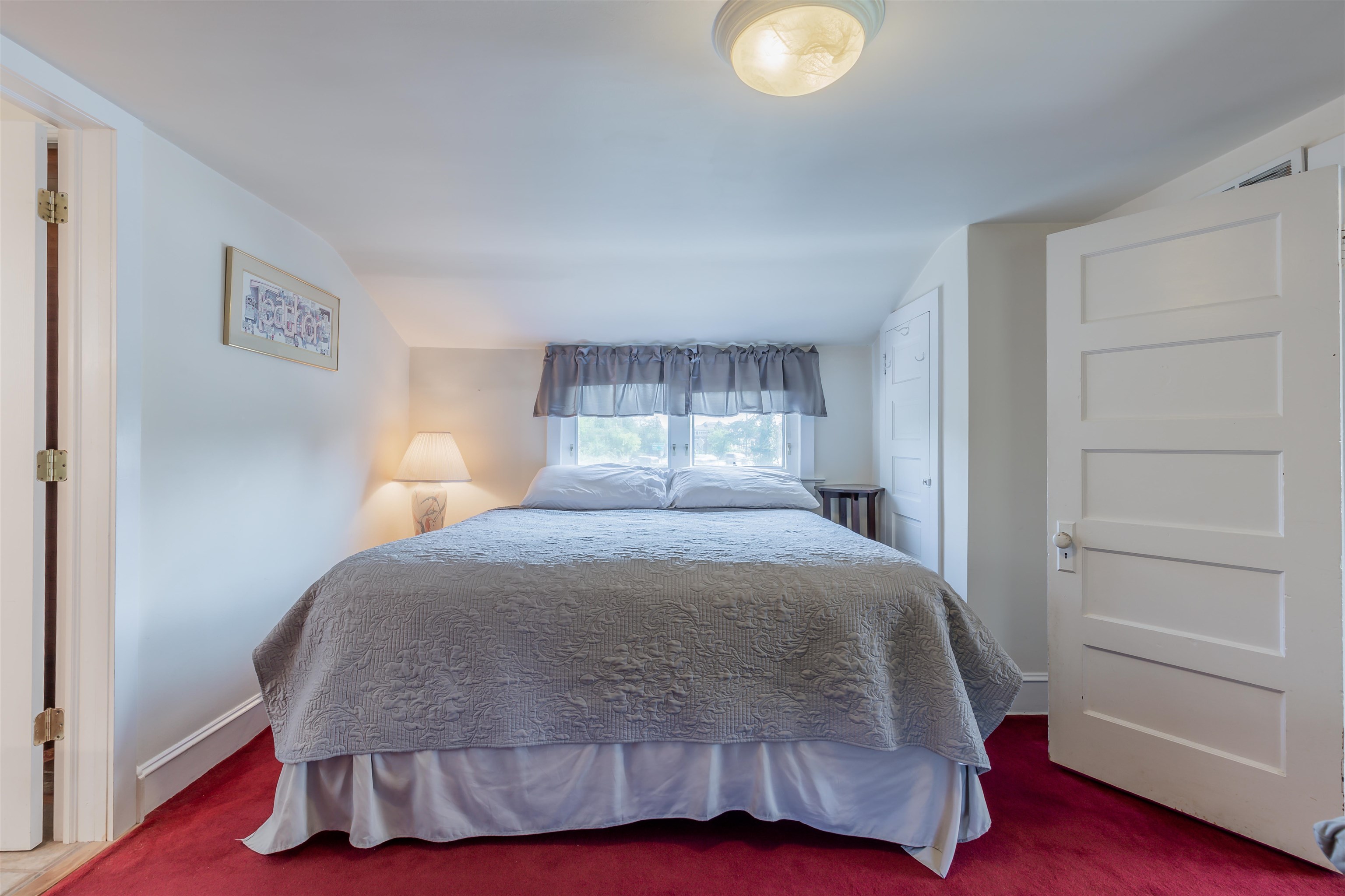1013 Seashore Road Cape May, NJ 08204 - Photo 29 of 44 a bedroom with a bed and a window