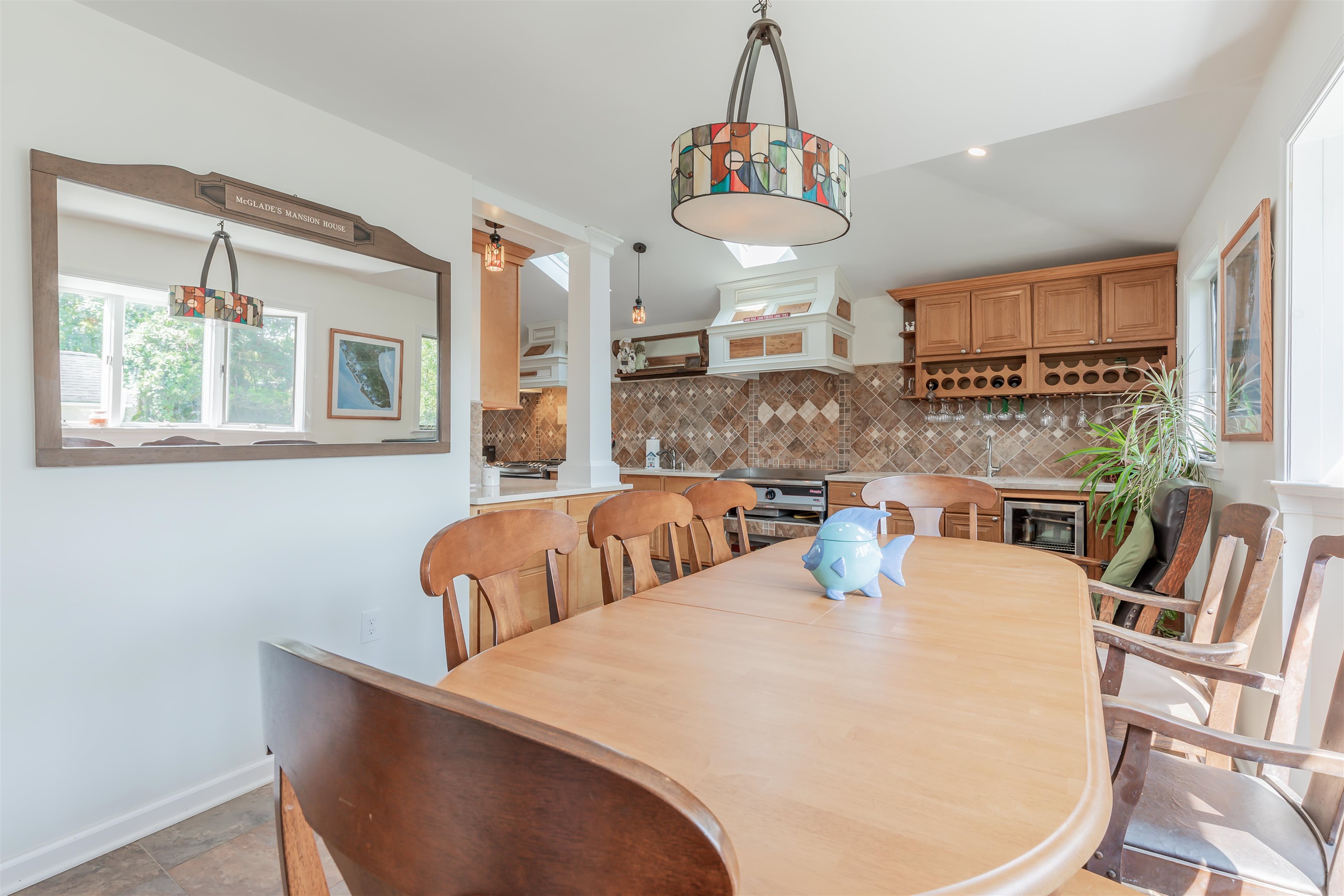 1013 Seashore Road Cape May, NJ 08204 - Photo 9 of 44 a view of a dining room with furniture window and wooden floor