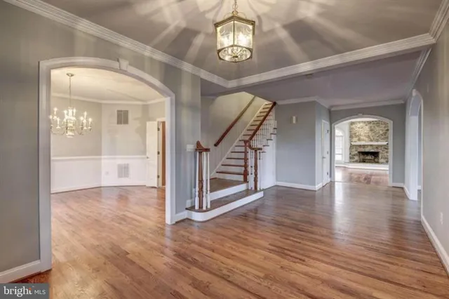 a view of an entryway with wooden floor