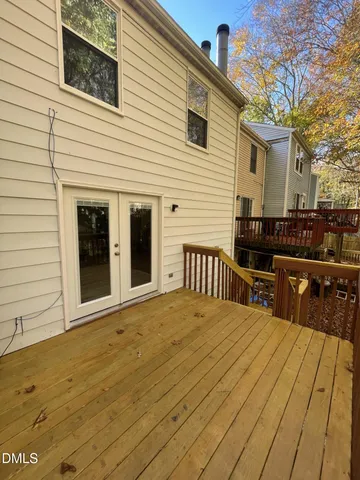 a view of a terrace with wooden floor and seating space