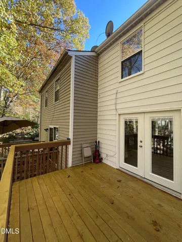 a view of a pathway with a wrought fence