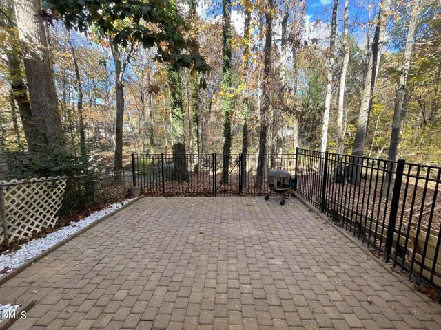 a view of a house with a porch and furniture