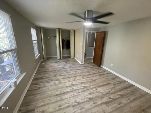 a view of a closet area with staircase