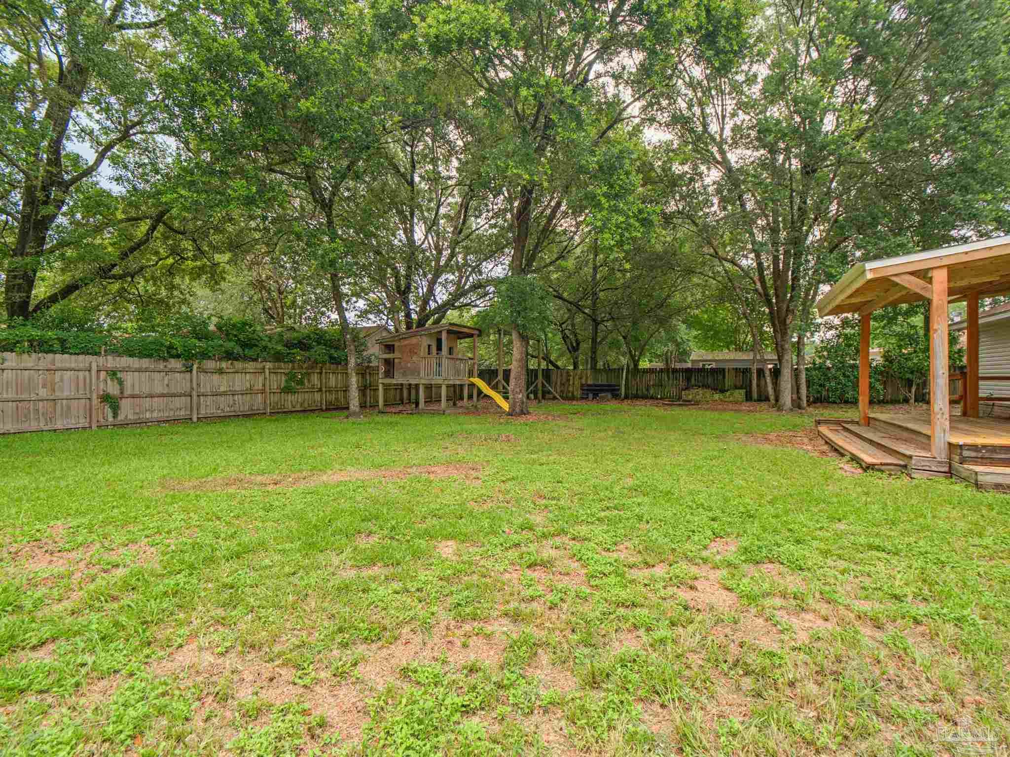 5567 Jones Street Milton, FL 32570 - Photo 44 of 48 a view of a house with a backyard