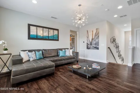 a bed room with a bed and a view of kitchen