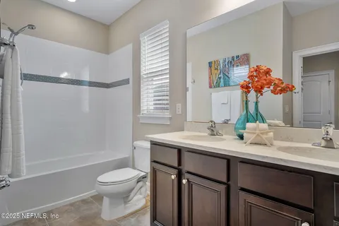a view of a chairs and table in patio