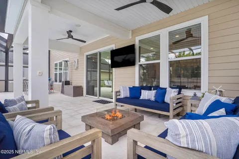 a view of a swimming pool with an outdoor space and seating area