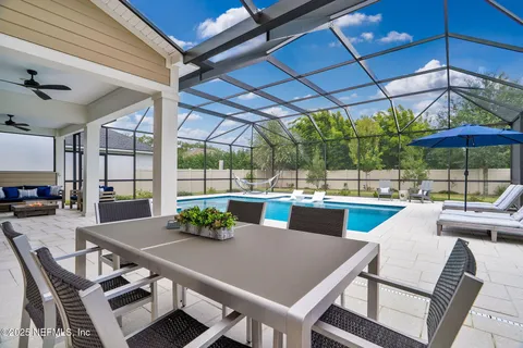 an aerial view of a house with outdoor space