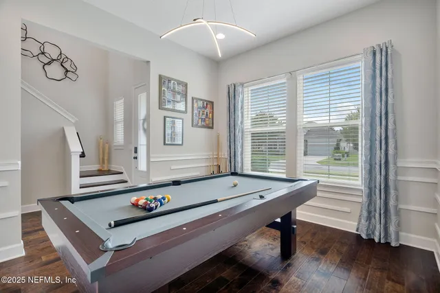 a view of an entryway with wooden floor