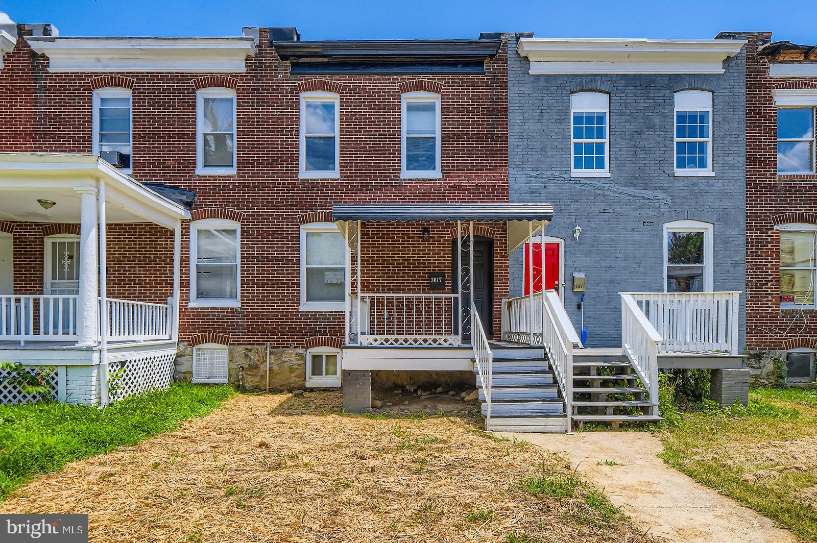 3617 Manchester Avenue Baltimore, MD 21215 - Photo 1 of 28 a front view of a house with a yard