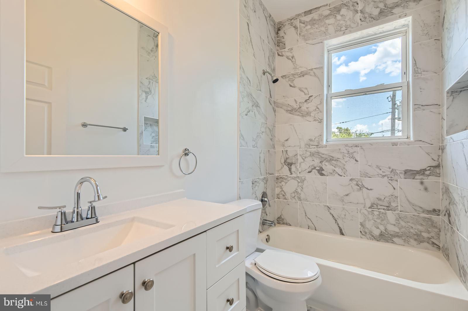 3617 Manchester Avenue Baltimore, MD 21215 - Photo 17 of 28 a bathroom with a sink a toilet and a bathtub