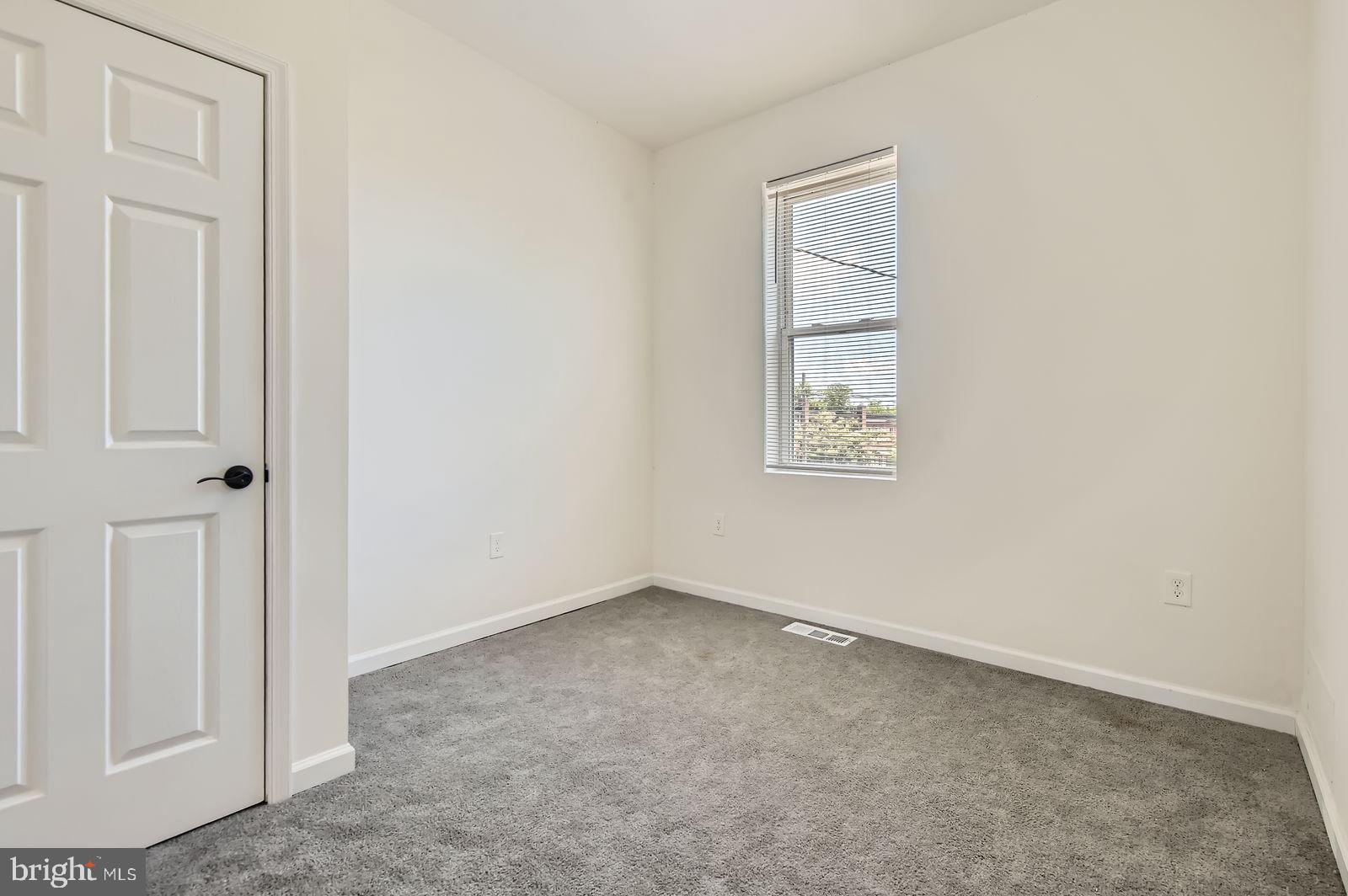 3617 Manchester Avenue Baltimore, MD 21215 - Photo 19 of 28 an empty room with windows