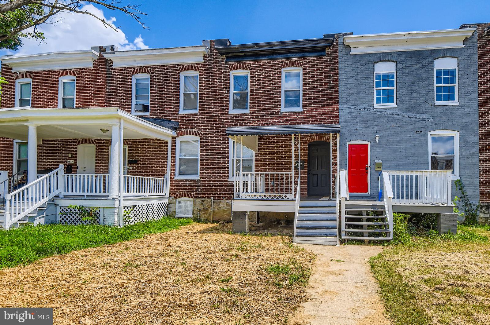 3617 Manchester Avenue Baltimore, MD 21215 - Photo 2 of 28 front view of a house with a yard