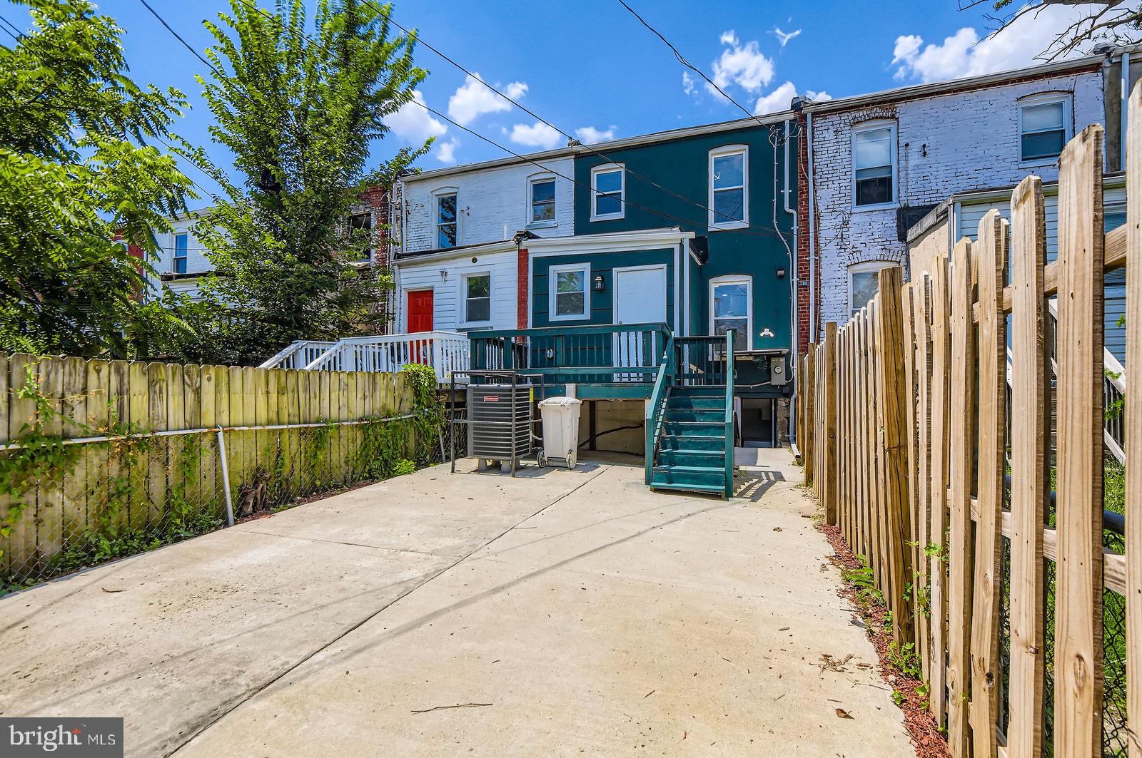 3617 Manchester Avenue Baltimore, MD 21215 - Photo 27 of 28 a view of a house with a wooden fence