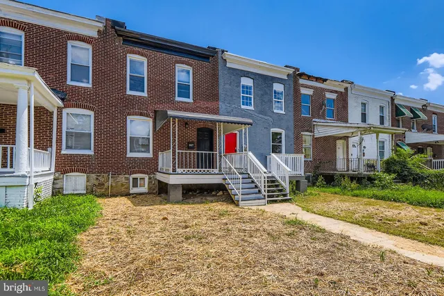 a view of a building with a yard
