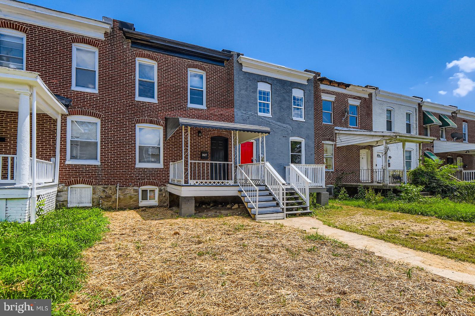 3617 Manchester Avenue Baltimore, MD 21215 - Photo 3 of 28 a view of a building with a yard
