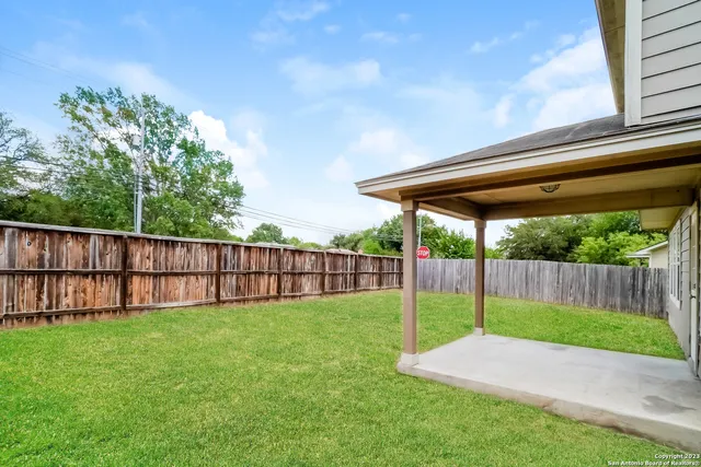 a backyard of a house with lots of green space