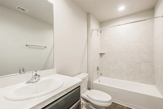 a bathroom with a sink a toilet and a bathtub