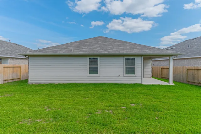 a backyard of a house with lots of green space