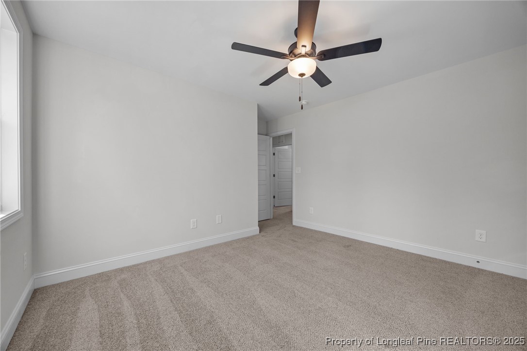 3162 Cameron Hill Road Cameron, NC 28326 - Photo 27 of 45 a view of an empty room with a chandelier fan