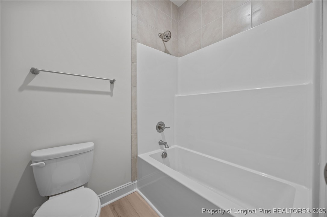 3162 Cameron Hill Road Cameron, NC 28326 - Photo 31 of 45 a bathroom with a toilet and a bathtub