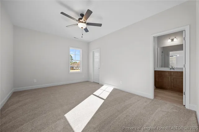 a view of an empty room and a window