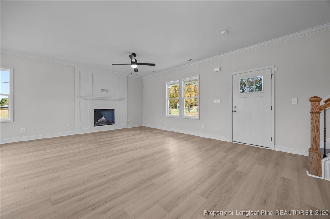 3162 Cameron Hill Road Cameron, NC 28326 - Photo 6 of 45 an empty room with windows and fireplace