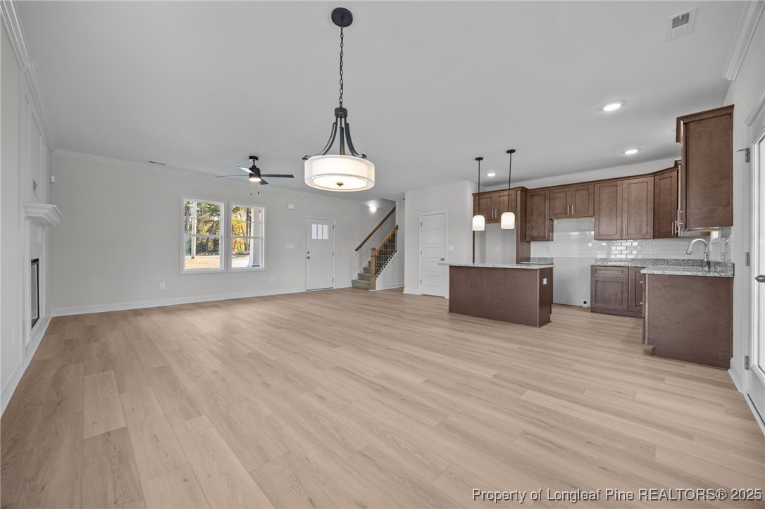 3162 Cameron Hill Road Cameron, NC 28326 - Photo 10 of 45 a view of a kitchen with a stove cabinets and wooden floor