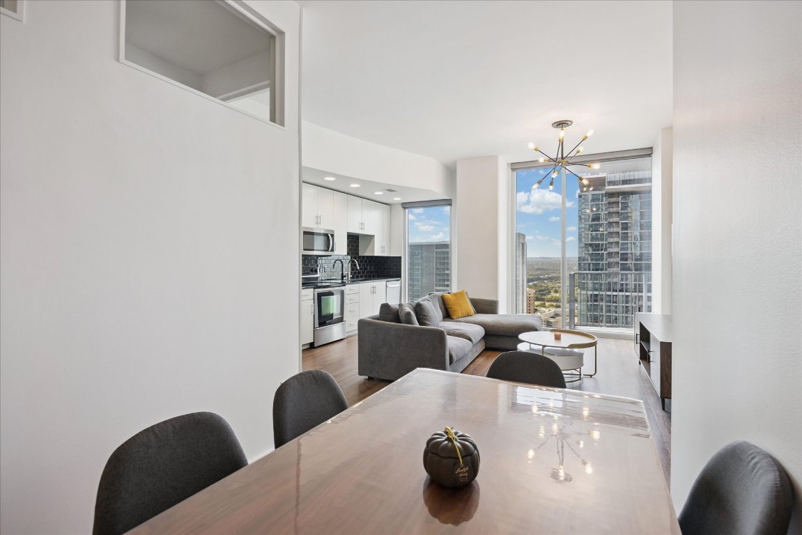 360 Nueces Street, Unit 2704 Austin, TX 78701 - Photo 13 of 40 a living room with furniture and view of kitchen