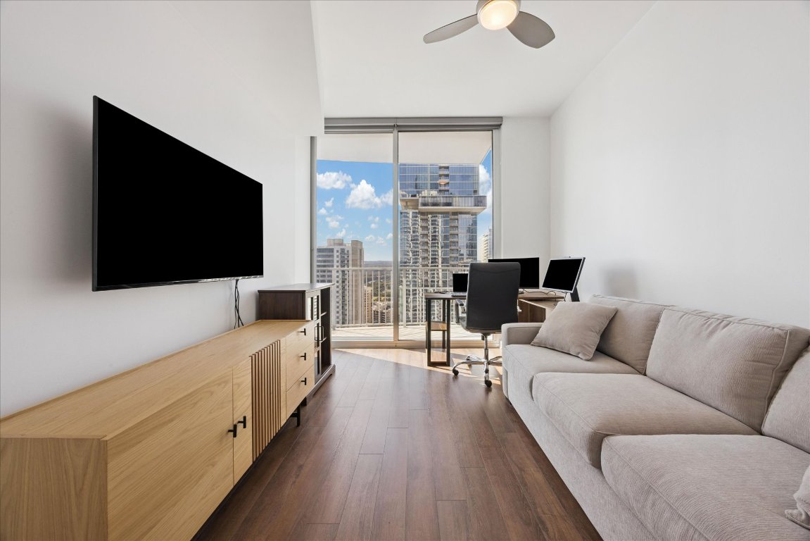 360 Nueces Street, Unit 2704 Austin, TX 78701 - Photo 16 of 40 a living room with furniture and a flat screen tv