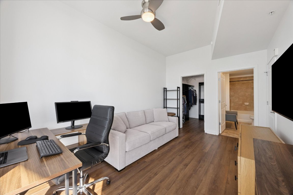 360 Nueces Street, Unit 2704 Austin, TX 78701 - Photo 20 of 40 a living room with furniture and a flat screen tv