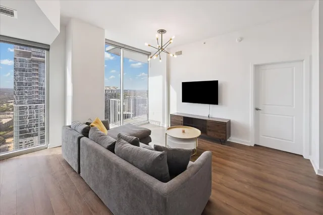 a living room with furniture and a flat screen tv