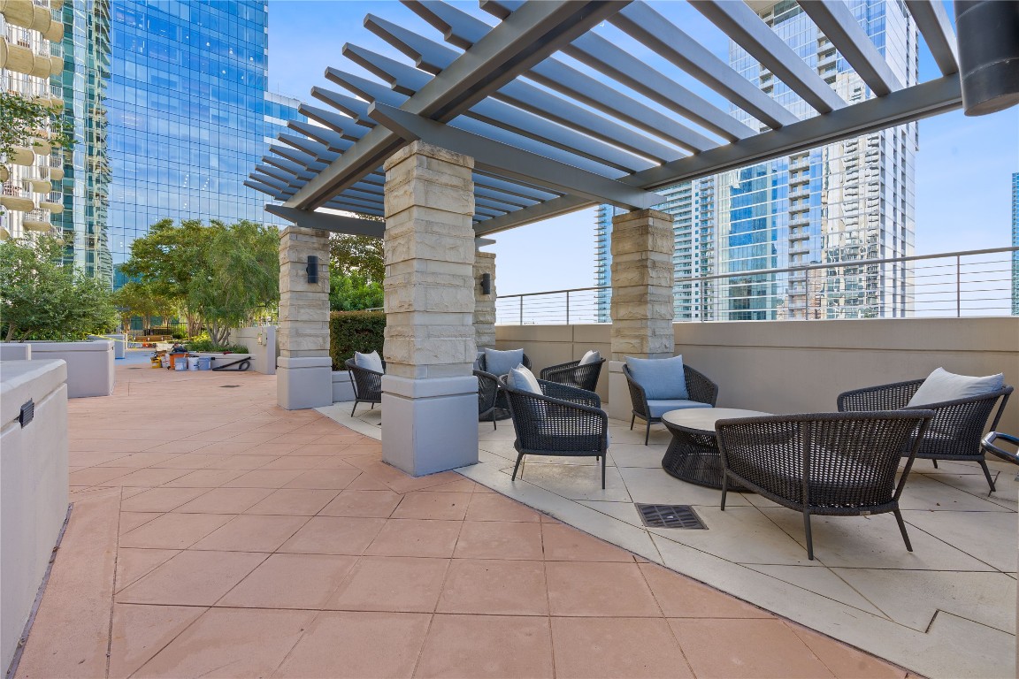 360 Nueces Street, Unit 2704 Austin, TX 78701 - Photo 36 of 40 a view of a patio with table and chairs and potted plants