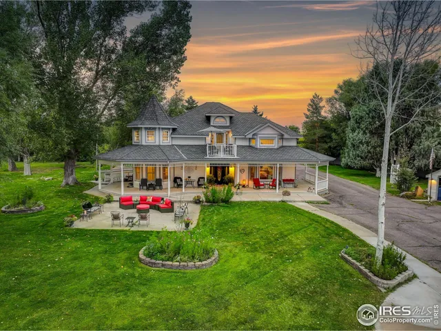 a front view of a house with a yard table and chairs