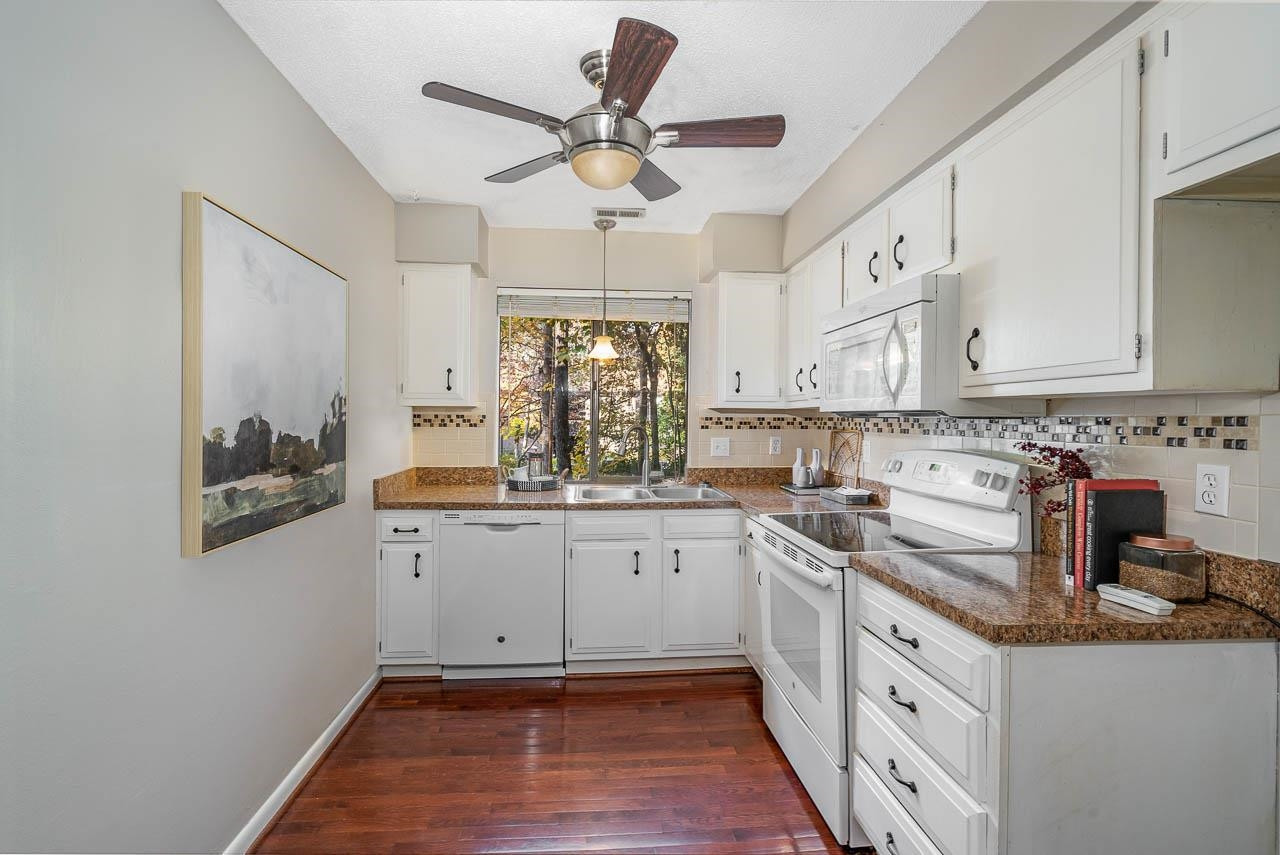3080 Colony Road, Unit 3080E Durham, NC 27705 - Photo 13 of 31 a kitchen with a sink cabinets and window