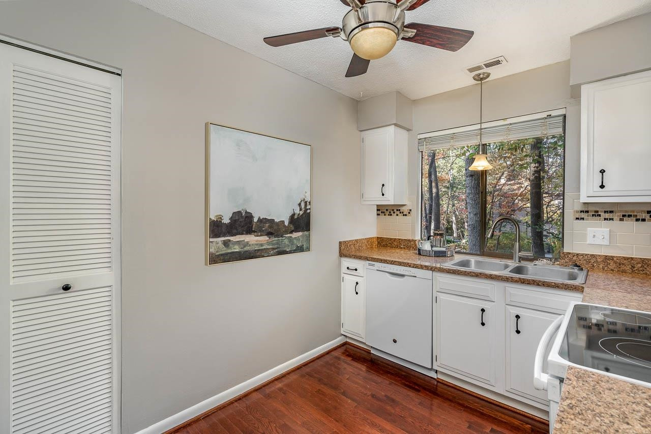 3080 Colony Road, Unit 3080E Durham, NC 27705 - Photo 14 of 31 a kitchen with stainless steel appliances granite countertop a stove a sink and a refrigerator