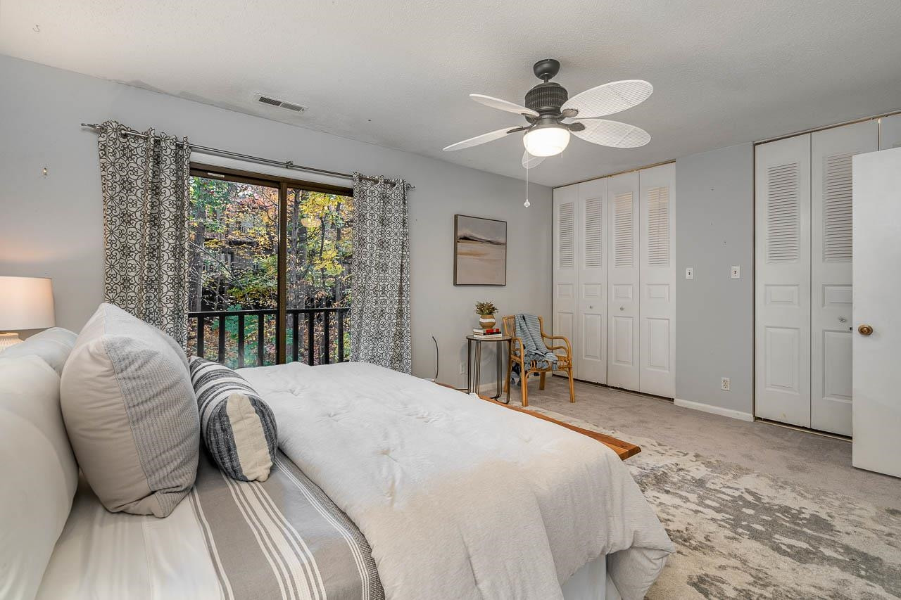 3080 Colony Road, Unit 3080E Durham, NC 27705 - Photo 20 of 31 a bedroom with a bed and a large window