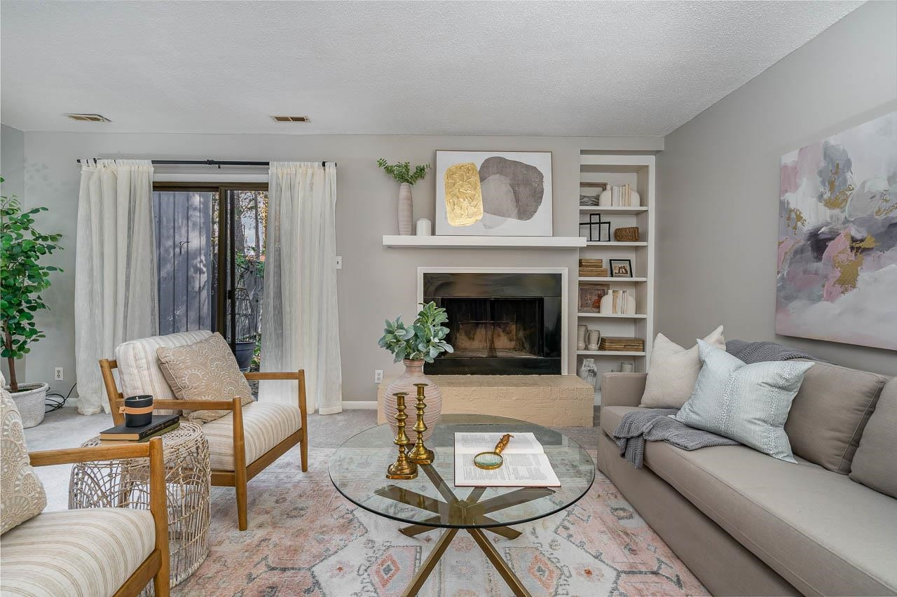 3080 Colony Road, Unit 3080E Durham, NC 27705 - Photo 2 of 31 a living room with furniture and a fireplace