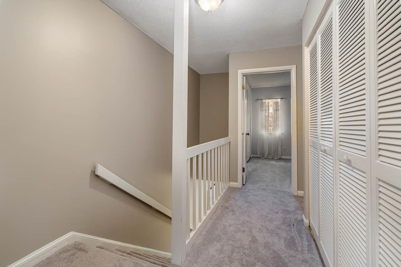 3080 Colony Road, Unit 3080E Durham, NC 27705 - Photo 22 of 31 a view of a hallway with wooden floor and entryway