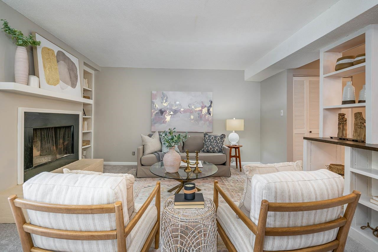 3080 Colony Road, Unit 3080E Durham, NC 27705 - Photo 3 of 31 a living room with furniture and a fireplace
