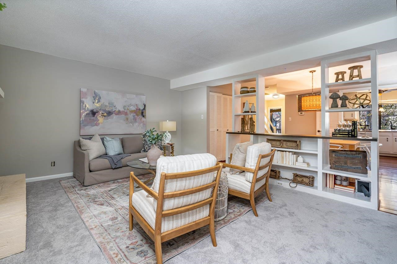 3080 Colony Road, Unit 3080E Durham, NC 27705 - Photo 7 of 31 a living room with furniture and a large window