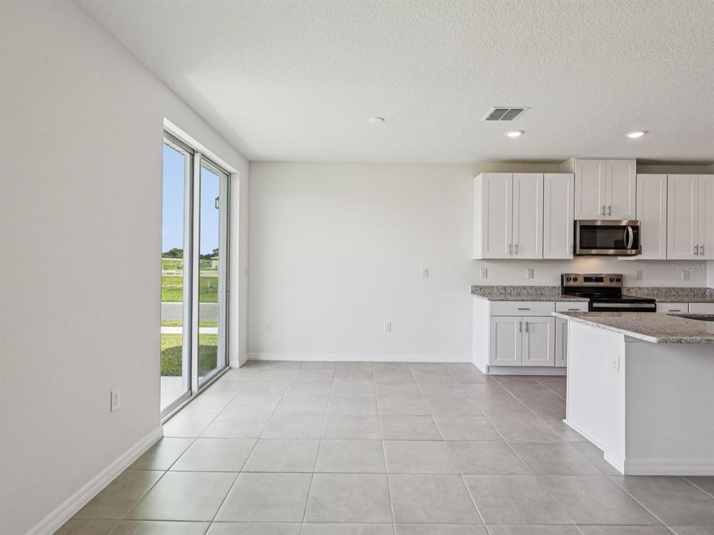 1646 Bark Rdg Drive Auburndale, FL 33823 - Photo 11 of 34 a view of a kitchen with electric appliances